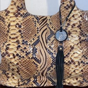 Sharif, leather tan animal print bag with hairlike material